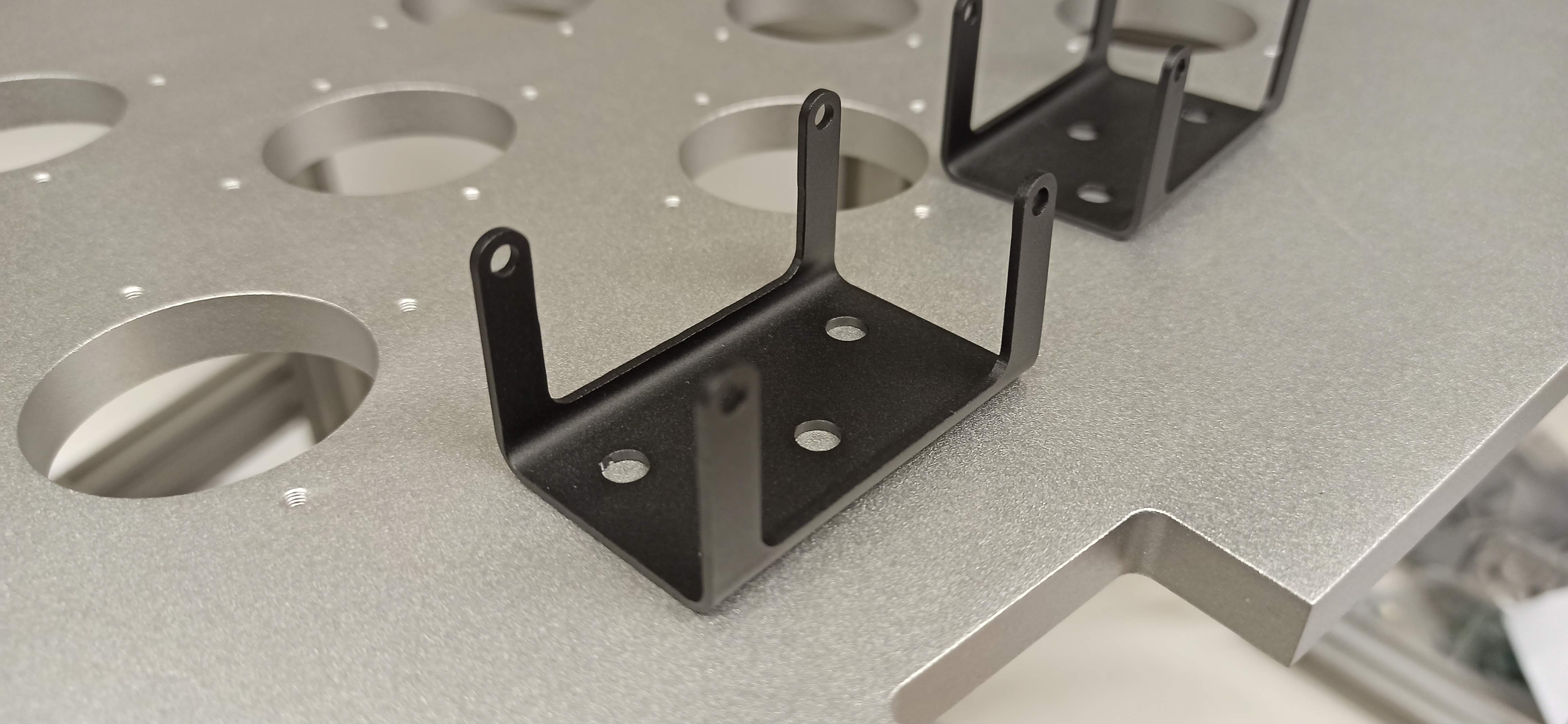 Photograph showing mechanical components with various surface finishes